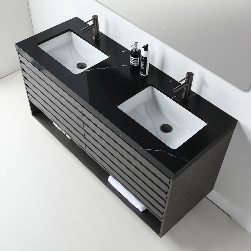A modern floating bathroom vanity with a light oak wood finish, a white countertop, and an integrated sink, shown in a styled bathroom setting with a bathtub, shower glass, and decorative plants.
