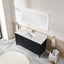 Bathroom with black vanity, white countertop, and large mirror.