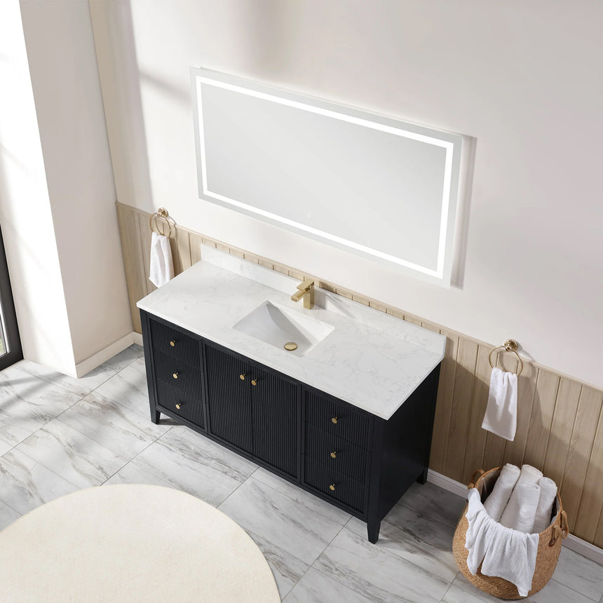 Bathroom vanity with double sink, mirrors, and towels in a well-lit room.