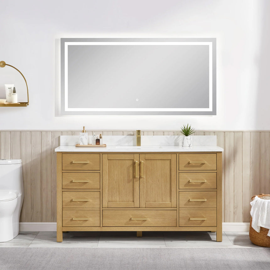 Bathroom vanity with wooden cabinets and white countertop, featuring a toilet and towel on the side.