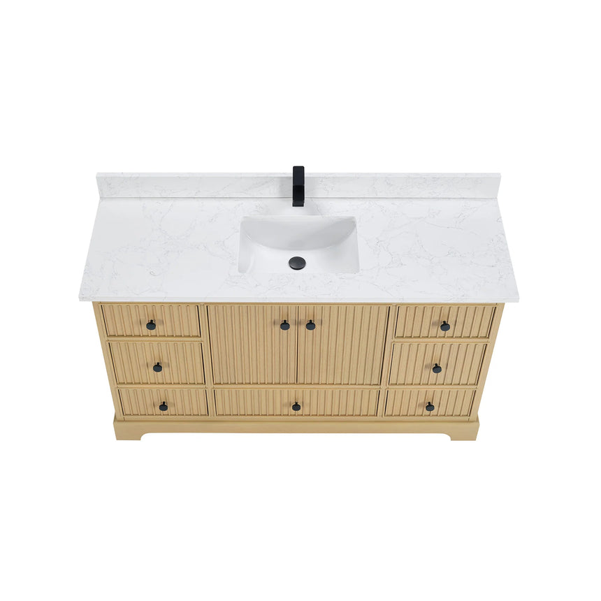 Bathroom vanity with wooden cabinet and white countertop in a bathroom setting.