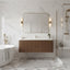 Modern bathroom with wooden vanity, marble walls, and freestanding bathtub.