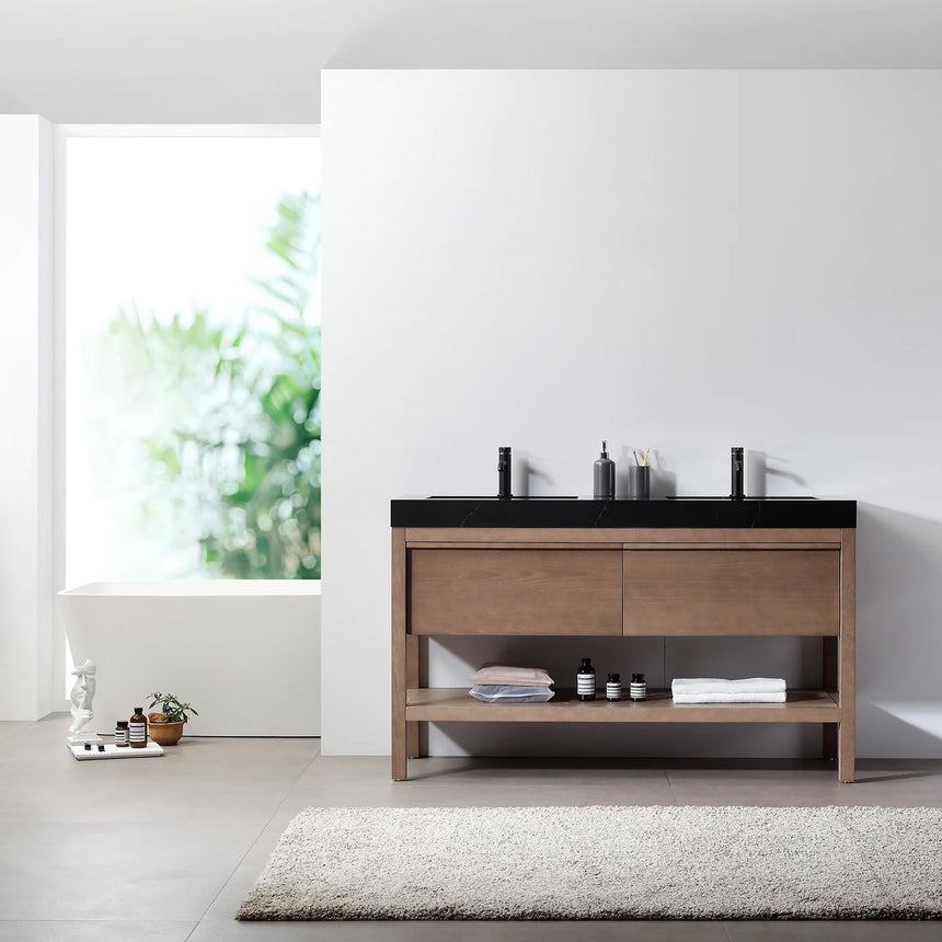 Bathroom vanity with black countertop and wooden cabinet in a bright room.