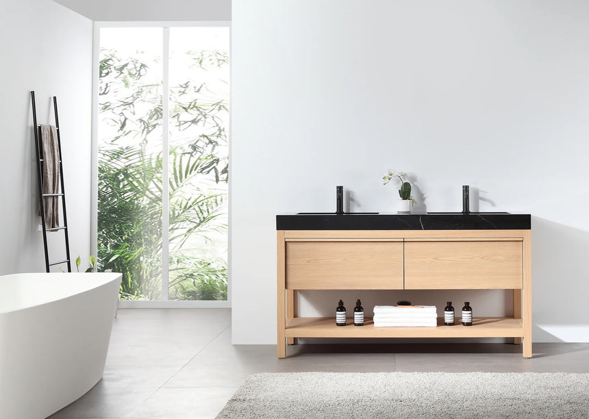 Bathroom vanity with black countertop and wooden cabinet in a bright room.