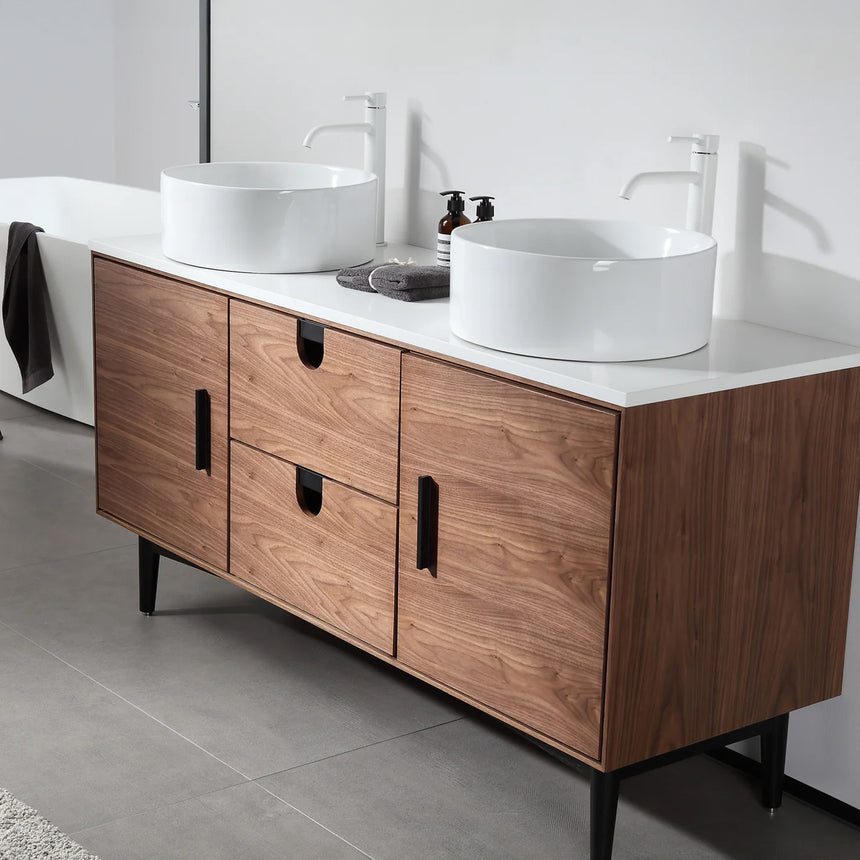 Bathroom vanity with two sinks, mirrors, and decorative elements.