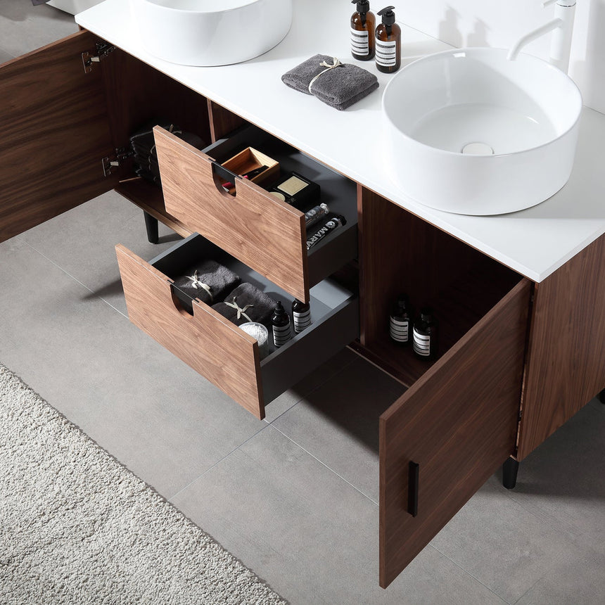 Bathroom vanity with two sinks, mirrors, and decorative elements.