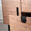 Wooden cabinet with black handles on a white background
