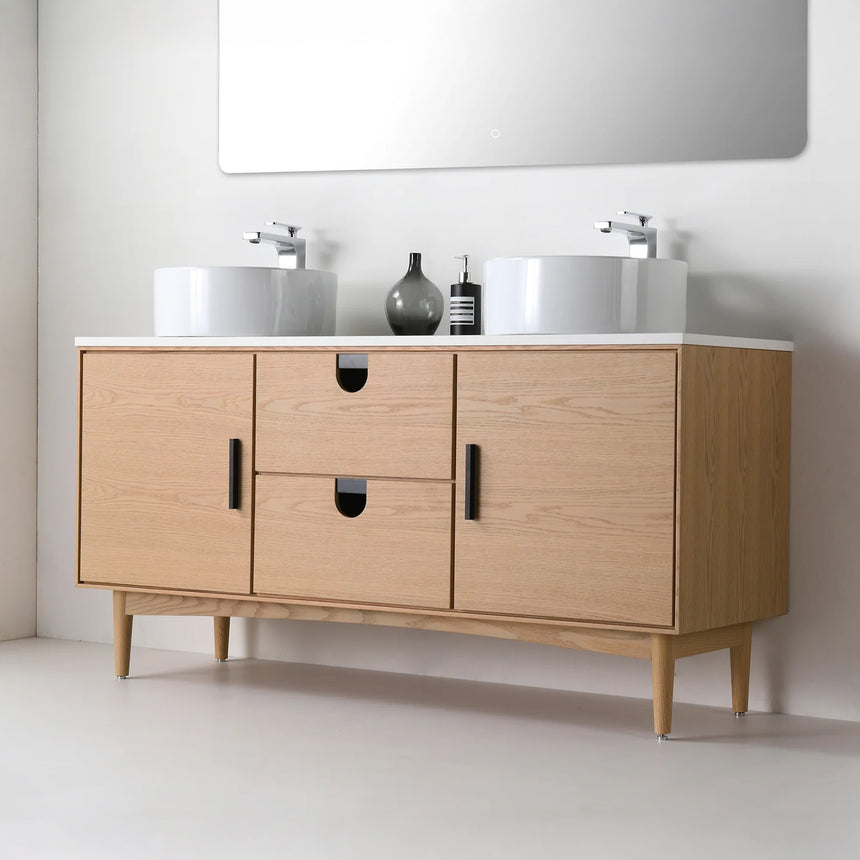 Bathroom vanity with two sinks, mirrors, and decorative elements.