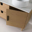 Wooden bathroom vanity with open drawer and white sink