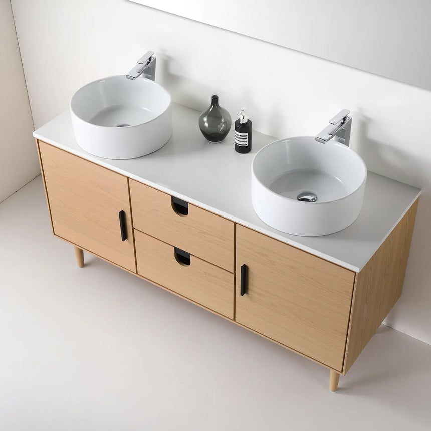 Bathroom vanity with two sinks, mirrors, and decorative elements.