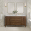 Bathroom vanity with double sink, mirrors, and decorative elements.