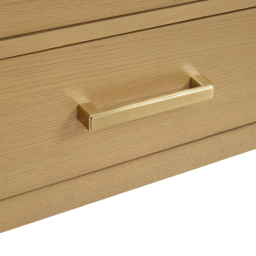 Bathroom vanity with wooden cabinets and white countertop, featuring a toilet and towel on the side.