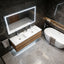 Modern bathroom with a sink, mirror, and bathtub.
