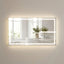 Large rectangular mirror with LED lighting on a wall, reflecting a bathroom interior.