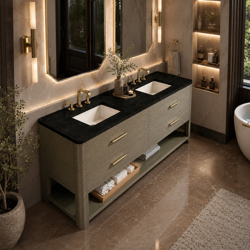 A modern bathroom vanity with a light oak wood frame, six drawers, an open lower shelf, and a white marble top with an integrated sink. The vanity is styled in a bright bathroom with a white freestanding tub, a gold faucet, and a glass shower stall in the background.