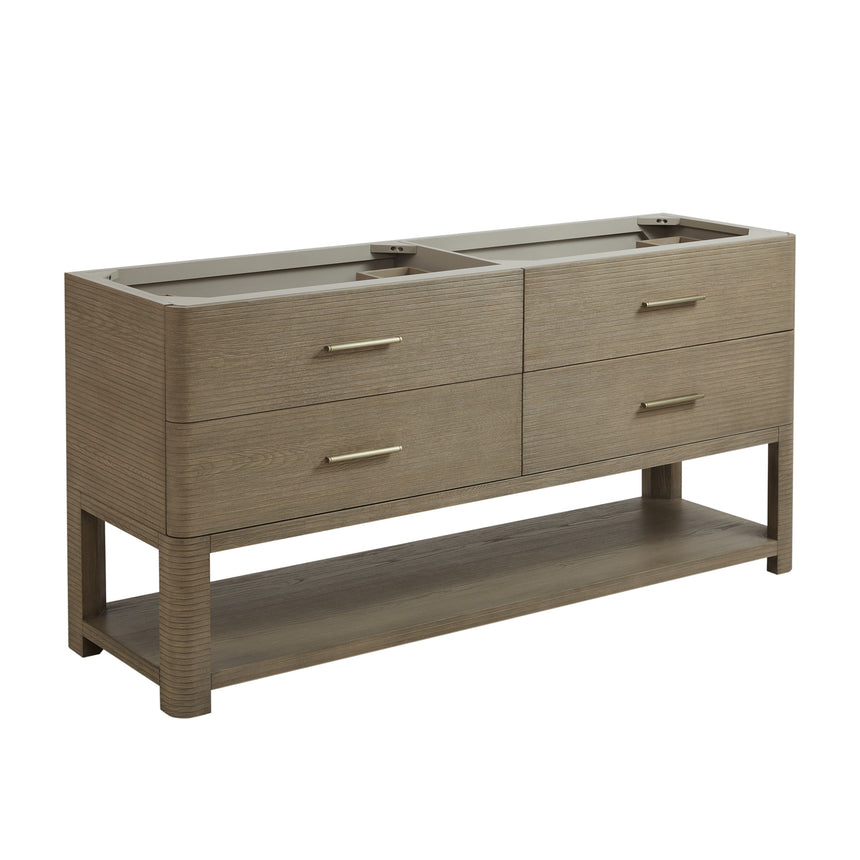 A modern bathroom vanity with a light oak wood frame, six drawers, an open lower shelf, and a white marble top with an integrated sink. The vanity is styled in a bright bathroom with a white freestanding tub, a gold faucet, and a glass shower stall in the background.