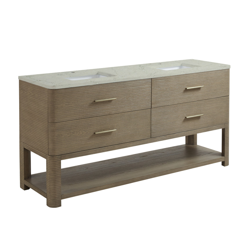 A modern bathroom vanity with a light oak wood frame, six drawers, an open lower shelf, and a white marble top with an integrated sink. The vanity is styled in a bright bathroom with a white freestanding tub, a gold faucet, and a glass shower stall in the background.