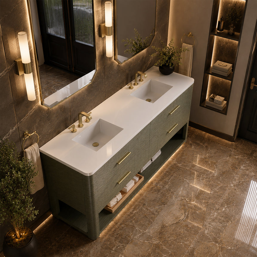 A modern bathroom vanity with a light oak wood frame, six drawers, an open lower shelf, and a white marble top with an integrated sink. The vanity is styled in a bright bathroom with a white freestanding tub, a gold faucet, and a glass shower stall in the background.