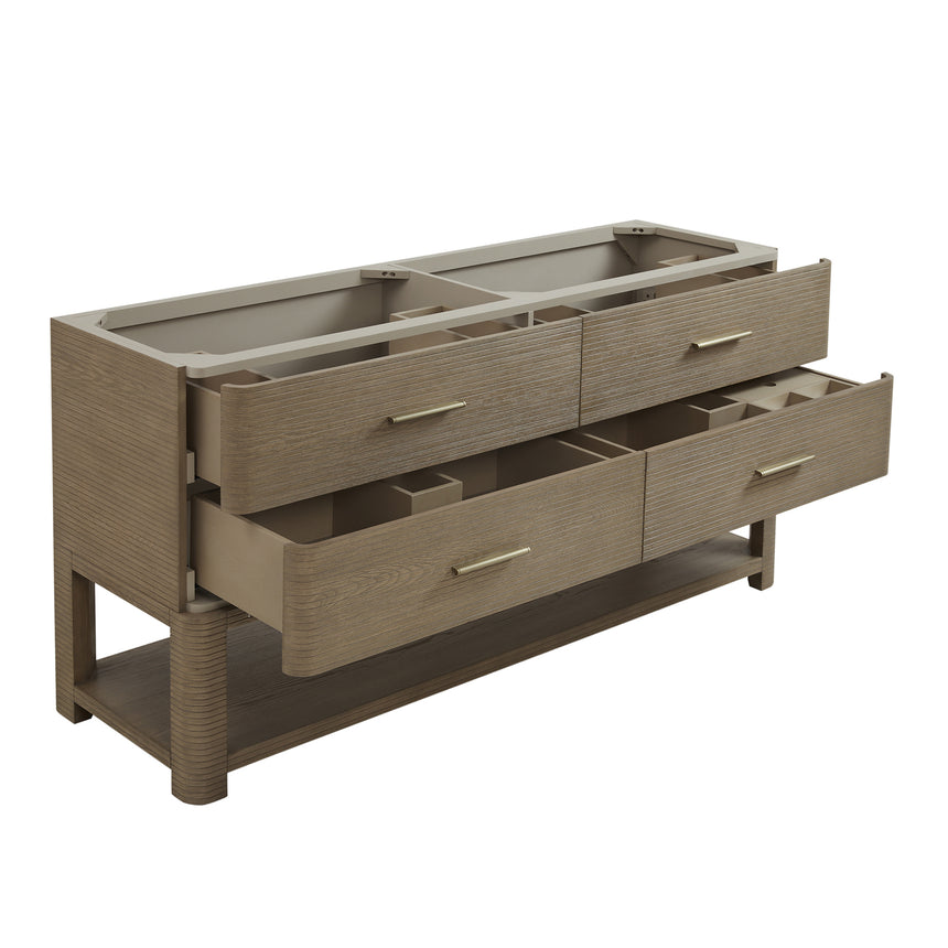 A modern bathroom vanity with a light oak wood frame, six drawers, an open lower shelf, and a white marble top with an integrated sink. The vanity is styled in a bright bathroom with a white freestanding tub, a gold faucet, and a glass shower stall in the background.