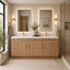 Modern bathroom with wooden vanity, mirrors, and decorative elements.
