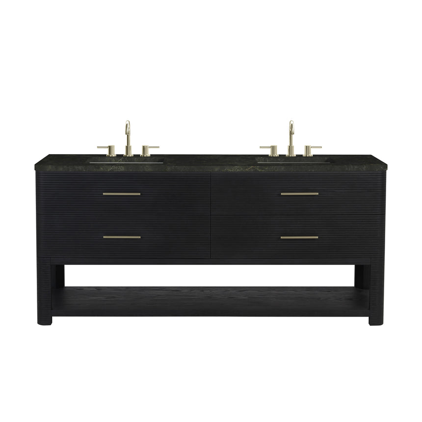A modern bathroom vanity with a light oak wood frame, six drawers, an open lower shelf, and a white marble top with an integrated sink. The vanity is styled in a bright bathroom with a white freestanding tub, a gold faucet, and a glass shower stall in the background.