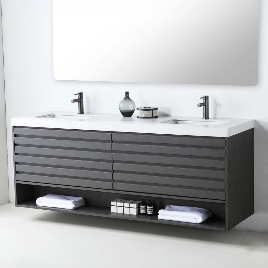 A modern floating bathroom vanity with a light oak wood finish, a white countertop, and an integrated sink, shown in a styled bathroom setting with a bathtub, shower glass, and decorative plants.
