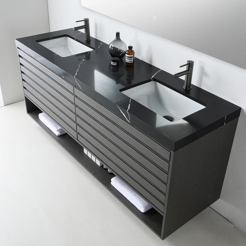 A modern floating bathroom vanity with a light oak wood finish, a white countertop, and an integrated sink, shown in a styled bathroom setting with a bathtub, shower glass, and decorative plants.