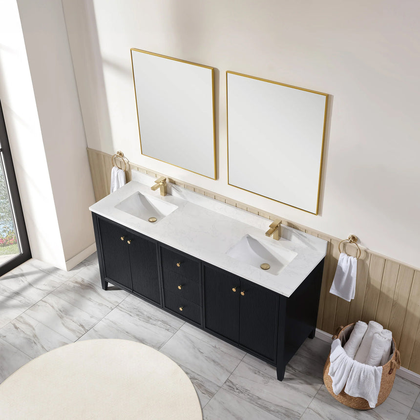 Bathroom vanity with double sink, mirrors, and towels in a well-lit room.