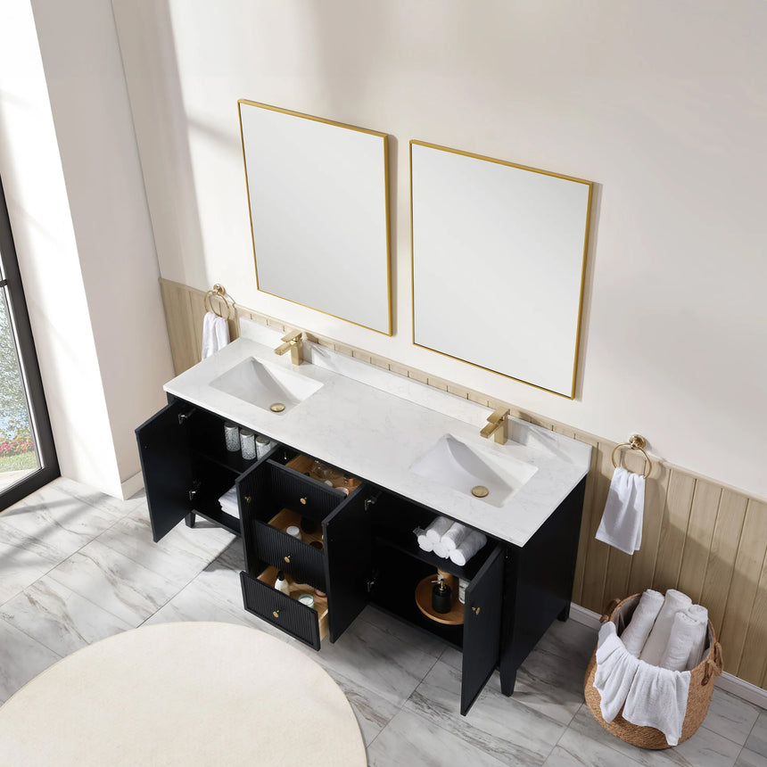 Bathroom vanity with double sink, mirrors, and towels in a well-lit room.