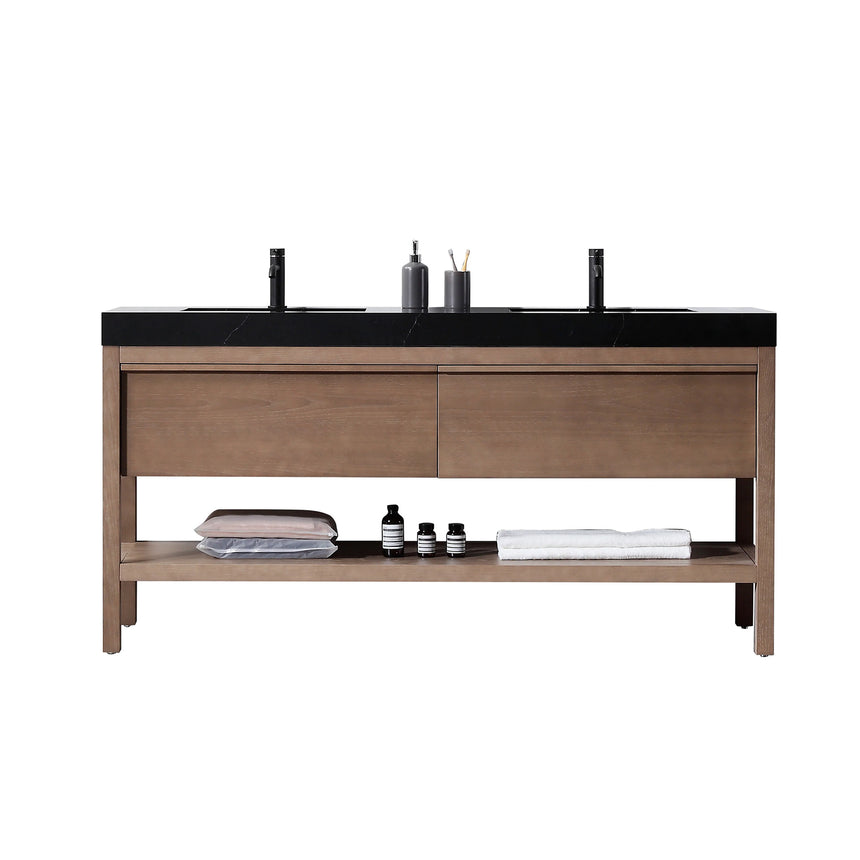 Bathroom vanity with black countertop and wooden cabinet in a bright room.