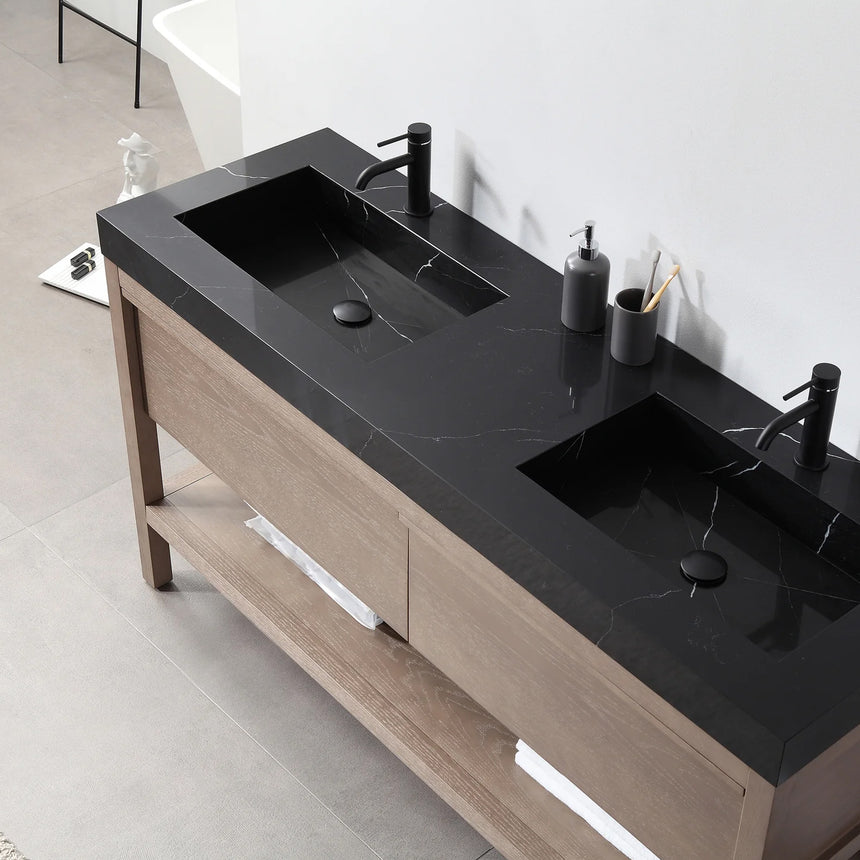 Bathroom vanity with black countertop and wooden cabinet in a bright room.
