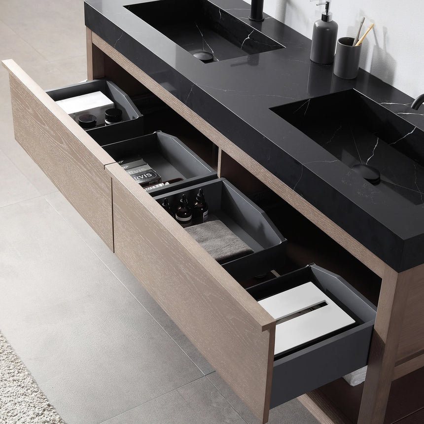 Bathroom vanity with black countertop and wooden cabinet in a bright room.