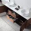 Bathroom vanity with open drawers containing toiletries, white sink, and wooden cabinet.