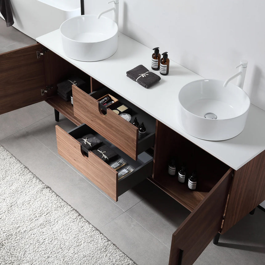 Bathroom vanity with two sinks, mirrors, and decorative elements.