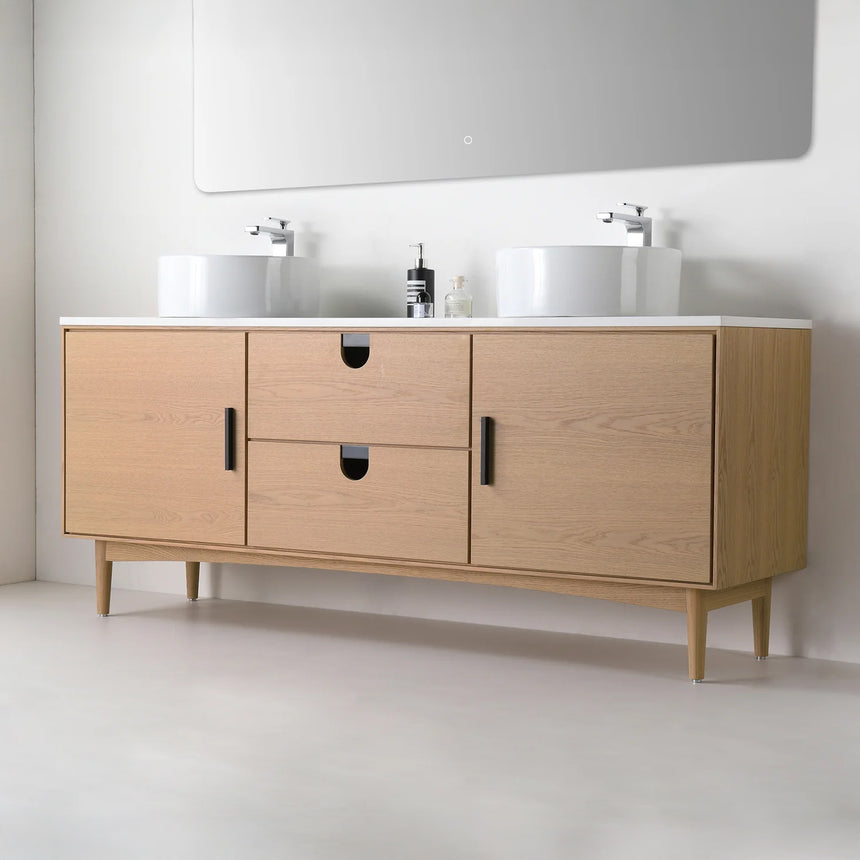 Bathroom vanity with two sinks, mirrors, and decorative elements.