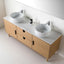 Bathroom vanity with two white sinks and wooden cabinets.