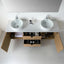 Bathroom vanity with two round sinks and open drawers revealing toiletries.