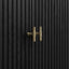 Black wooden door with gold handle