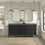 Bathroom vanity with mirrors and lighting fixtures in a modern bathroom setting.