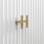 Gold handle on a white door