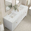 Bathroom vanity with marble countertop, sinks, and gold fixtures.