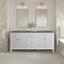 Bathroom vanity with two mirrors, lights, and a freestanding bathtub.
