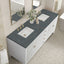 Bathroom vanity with dark marble countertop and white sinks.