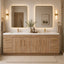Modern bathroom with wooden vanity, mirrors, and decorative elements.