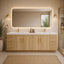 Bathroom with wooden vanity, large mirror, and decorative elements.