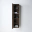 A tall, narrow wall-mounted bathroom cabinet with a dark brown wood finish, shown with its left door open to reveal three interior shelves holding toiletries, set against a plain white wall.