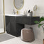 Modern bathroom vanity with black cabinet, mirror, stool, and a floating makeup table.