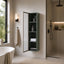 Linen Cabinet in forest green finish with glass door open, modern bathroom.