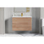 Bathroom vanity with wooden finish and white countertop against a gray wall.