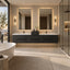 Modern double-sink bathroom vanity in a luxury bathroom setting, featuring a floating dark charcoal double vanity with white integrated sinks, two backlit rectangular mirrors, wall sconces, a freestanding white bathtub, and a glass shower enclosure.